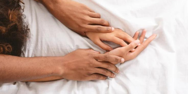 4 arms twisted together in bed on "https://sexualhealth.website/" website